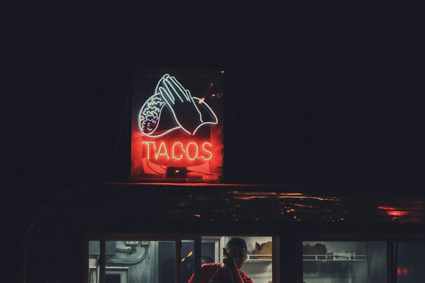 The trailer at night, neon sign lit
